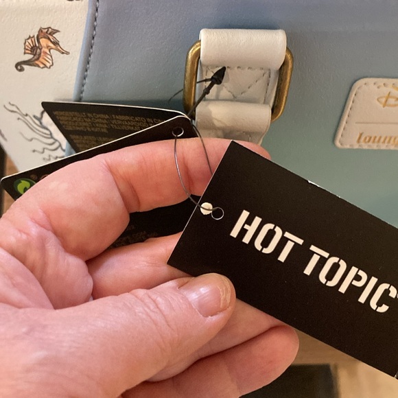 Ariel, sitting under moon satchel, lounge, fly purse - Picture 8 of 11